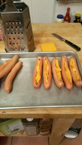 Note that the hot dogs are cut to have a pocket, rather than sliced open.